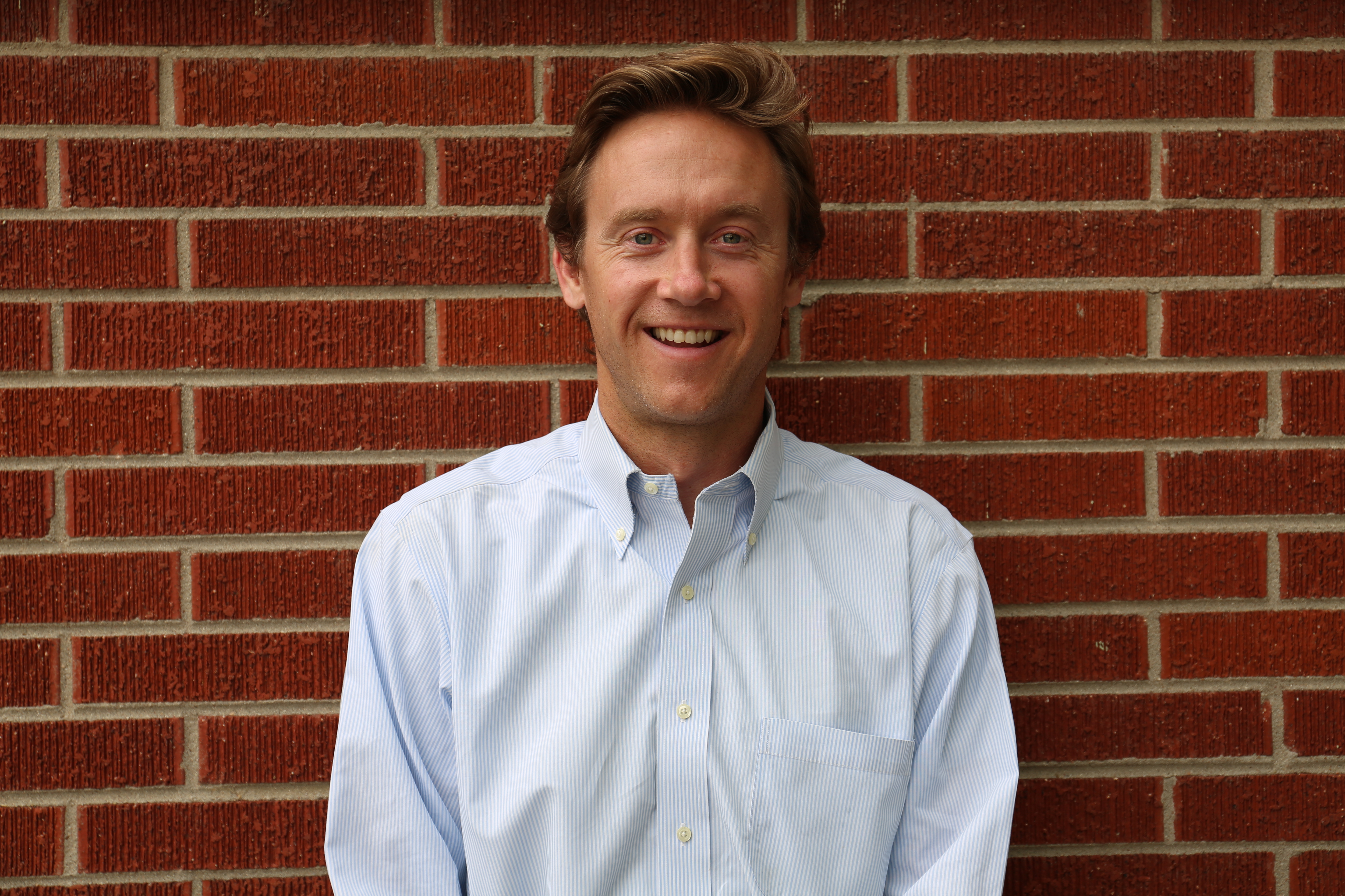 Mike Johnston, archival 2017 portrait. Illustration of Denver civic leadership; not a photograph of a Burnham Yard meeting.